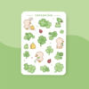 Sticker sheet with cute little ducklings, ladybugs and clovers